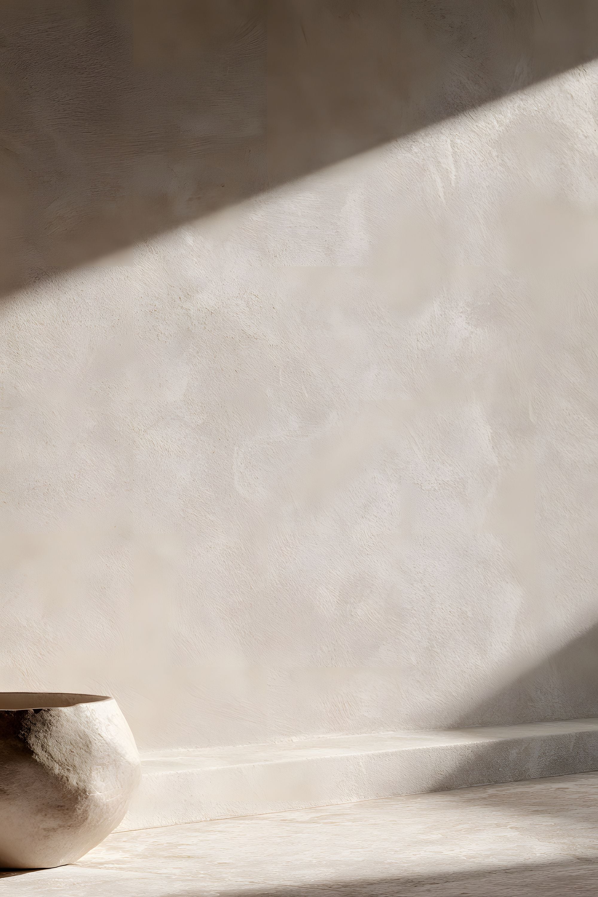 Quiet Objects No. 05 minimal still life artwork with a partial stone vessel set against a textured cream wall with strong diagonal light and shadow.