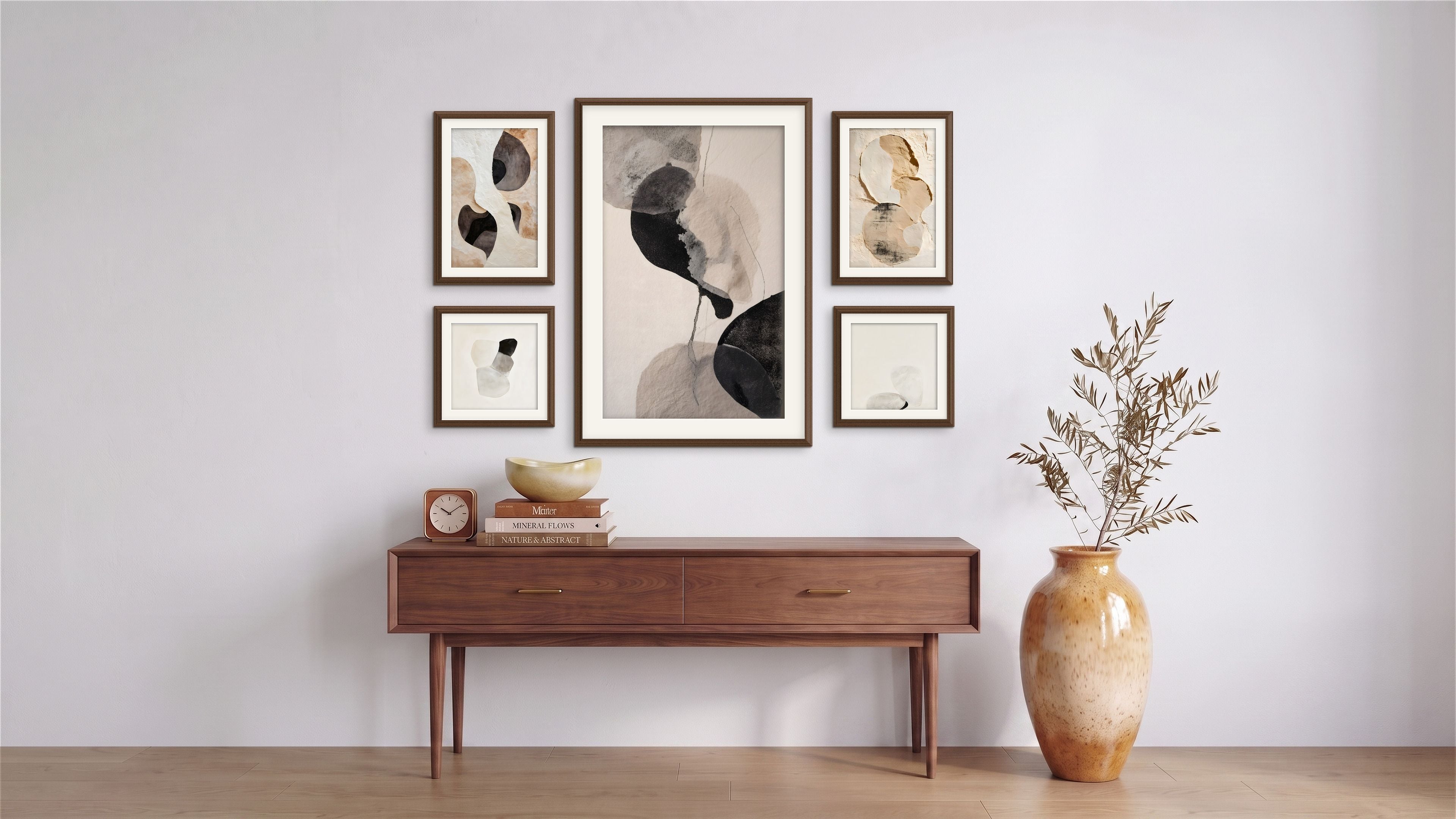 Five Soft Structure abstract artworks in black, cream, beige, and warm neutral tones arranged as a gallery wall above a mid-century wood console.
