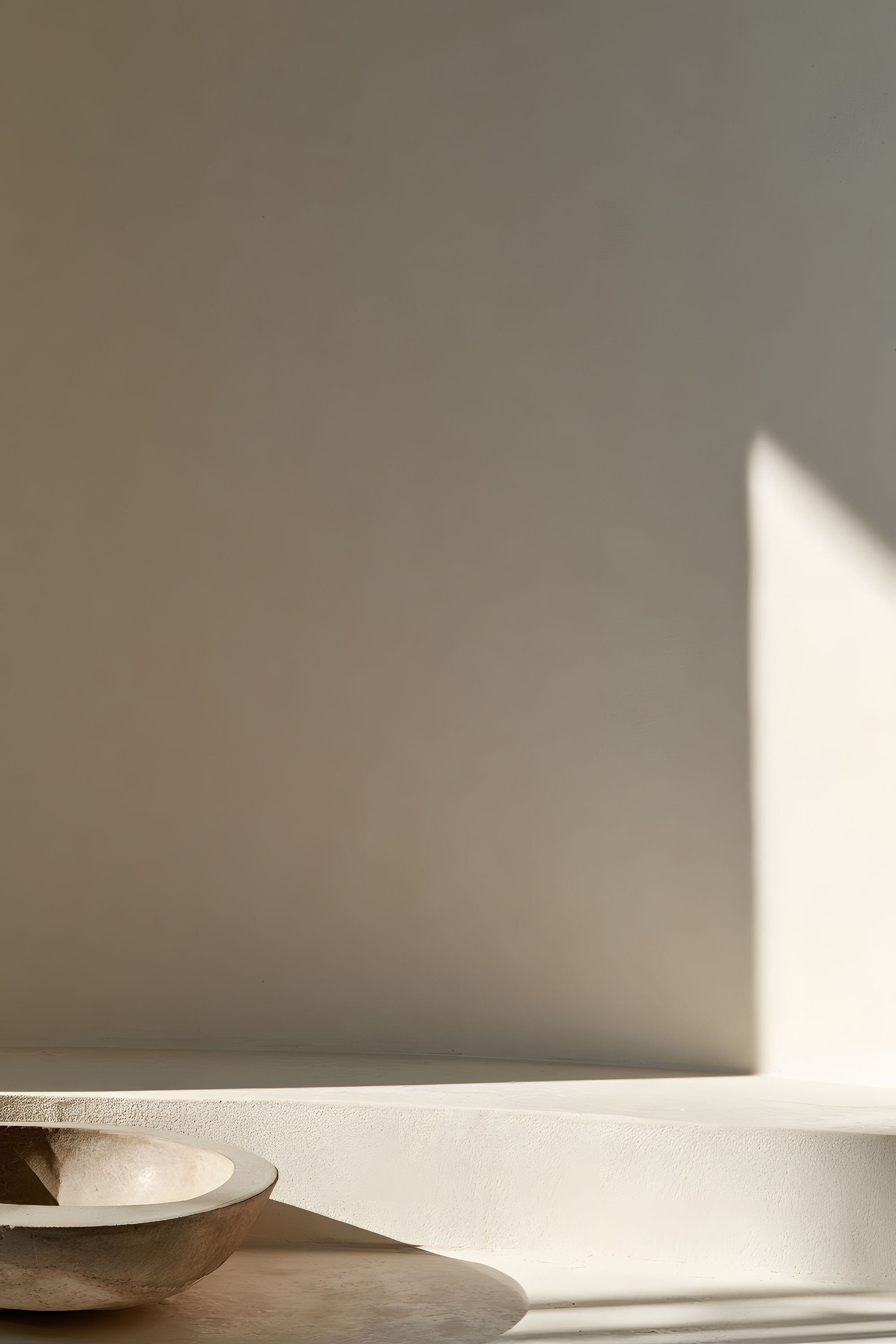 Quiet Objects No. 06 minimal still life artwork with a shallow stone bowl, warm neutral walls, and a sharp beam of natural light.